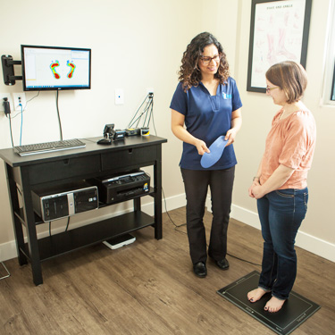 Dr. Pannu scanning patient's foot