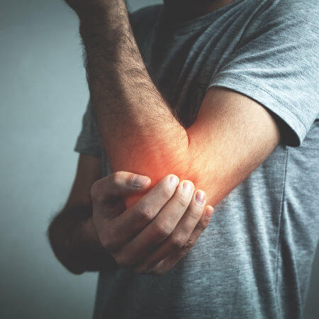man with elbow pain
