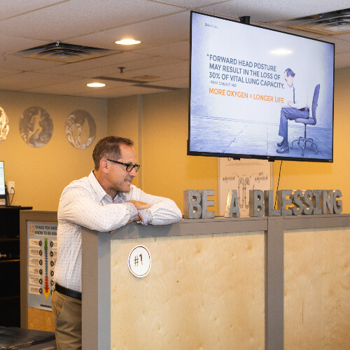 Calgary SE Chiropractor Dr. Jeff at front desk