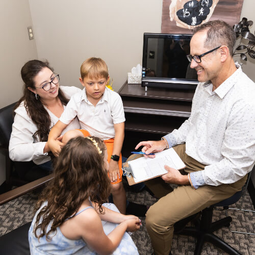 Calgary SE Chiropractor Dr. Jeff talking to mom and kids