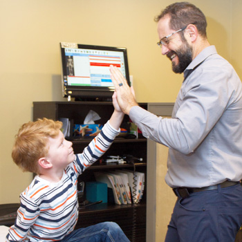 Dr. Jeff with a happy young patient