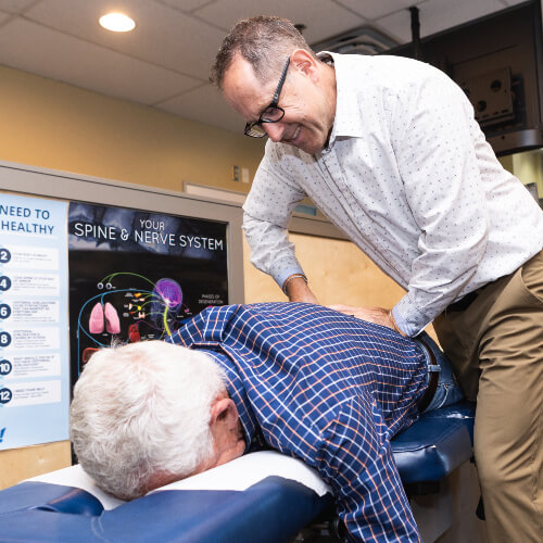 Calgary SE Chiropractor Dr. Jeff adjusting man's back