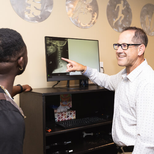 Calgary SE Chiropractor Dr. Jeff pointing to xray