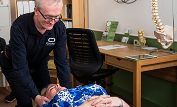 Connect Spinal Health patient having neck adjusted
