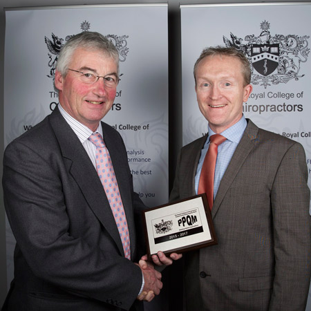 Chiropractor Edinburgh, Andrew Feltoe, receiving award. 