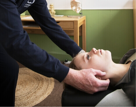 Connect Spinal Health patient getting neck adjusted