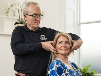 Connect Spinal Health patient having neck adjusted