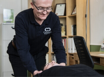 Connect Spinal Health patient having shoulders adjusted