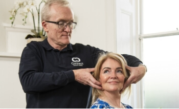 Connect Spinal Health patient having neck adjusted