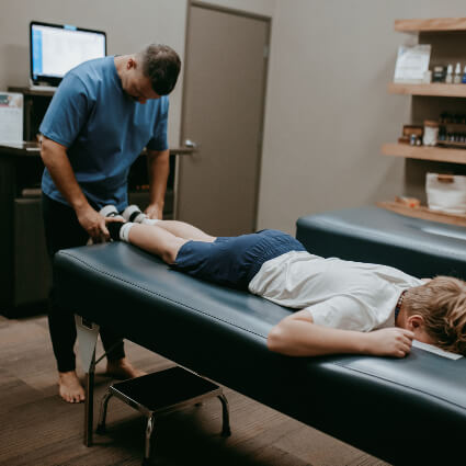 Pediatric Chiropractic Holding feet