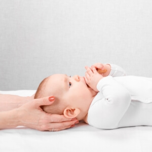baby laying on table
