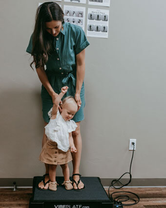 Mother and daughter standing on plate