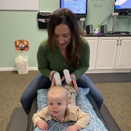 dr michelle examining baby''s legs