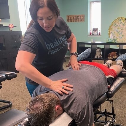 Dr Michelle adjusting mans back