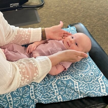 baby having neck adjusted