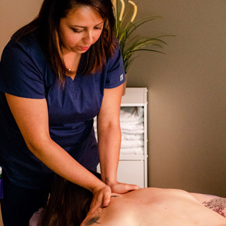Massage Therapist performing massage