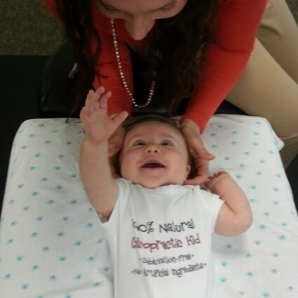 baby having neck adjusted