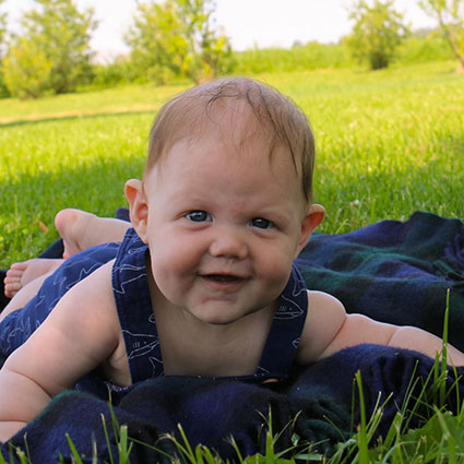 Baby laying on blanket