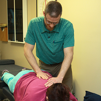 Dr. Steve adjusting patient