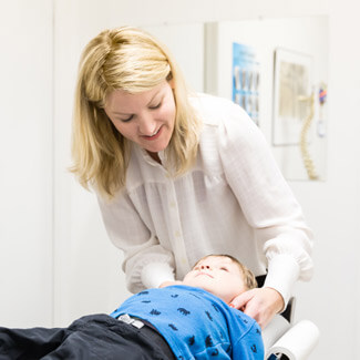 Dr. Allison giving child adjustment