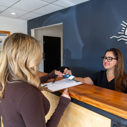 San Marcos patient checking in at Life Source Chiropractic