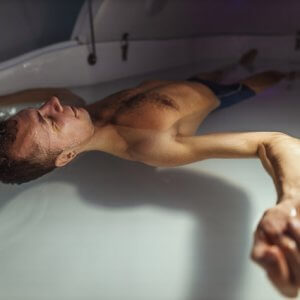 man relaxing in floatpod