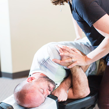 Man receiving a chiropractic adjustment