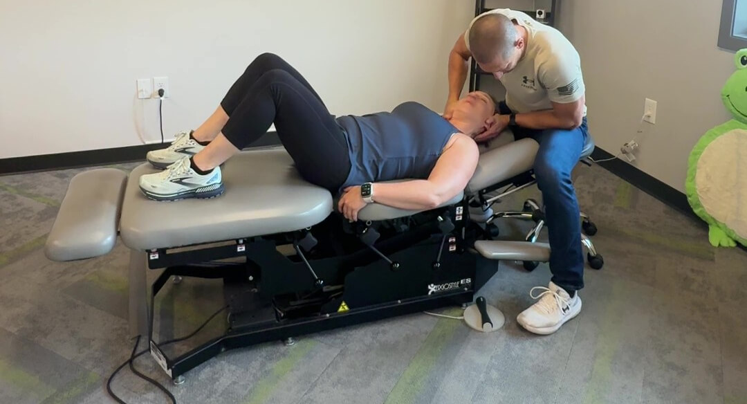 Inver Grove Heights chiropractor adjusting patient's neck