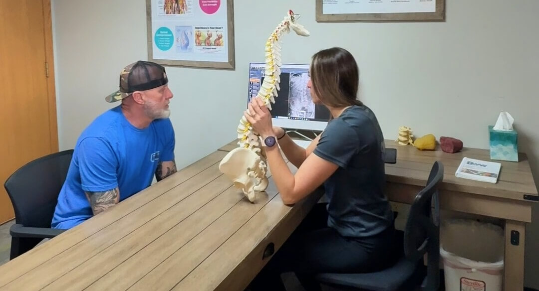 Inver Grove Heights patient in consultation with chiropractor