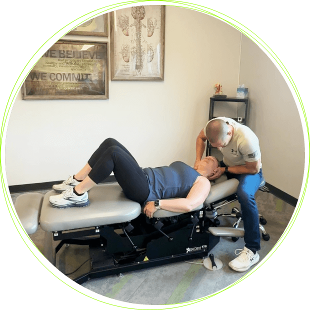Inver Grove Heights Chiropractor Dr. Ross Crain adjusting patient