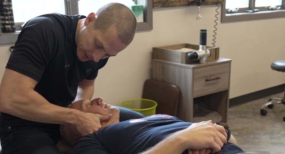 Inver Grove Heights chiropractor adjusting patient's neck