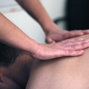 Massage therapist applying massage