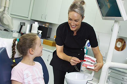 Jackie Edmunds with a child patient