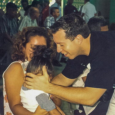 Dr. Kleinburg adjusting a little girl