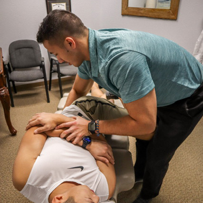 Dr. Abrahamson adjusting a patient