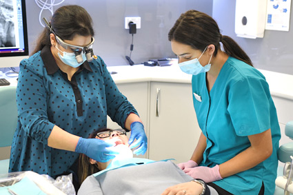 Dr Ishita examining a patient