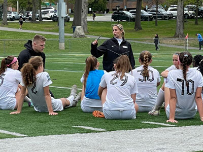 Kelly with soccer players