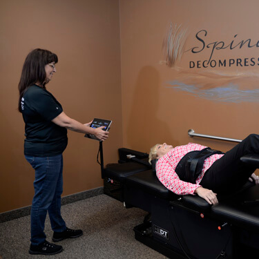 Patient on spinal decompression table