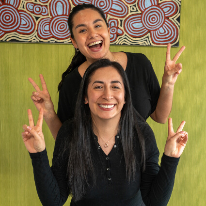 Staff giving peace sign