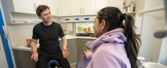 dentist consulting with patient