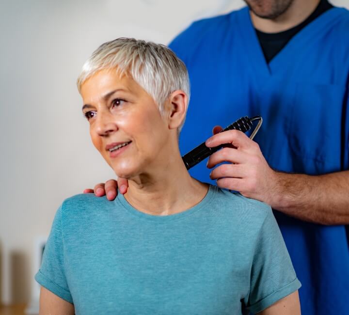 woman having physio treatment done on her neck