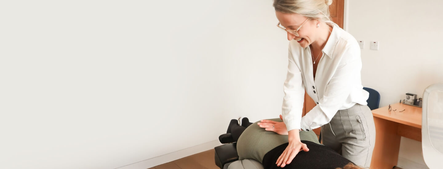 Leeds chiropractor adjusting patients lower back
