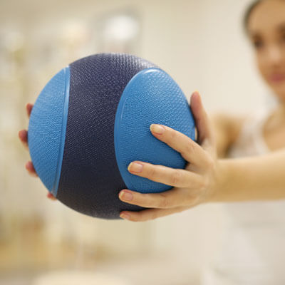 person holding therapy ball