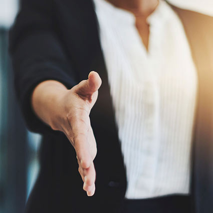 person holding out their hand for a handshake