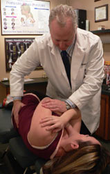 Dr. Martin adjusting a patient.