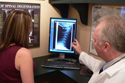 Dr Martin showing patient their xrays.