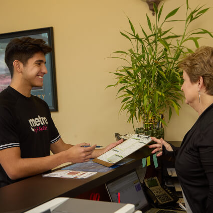 patient checking in at front desk