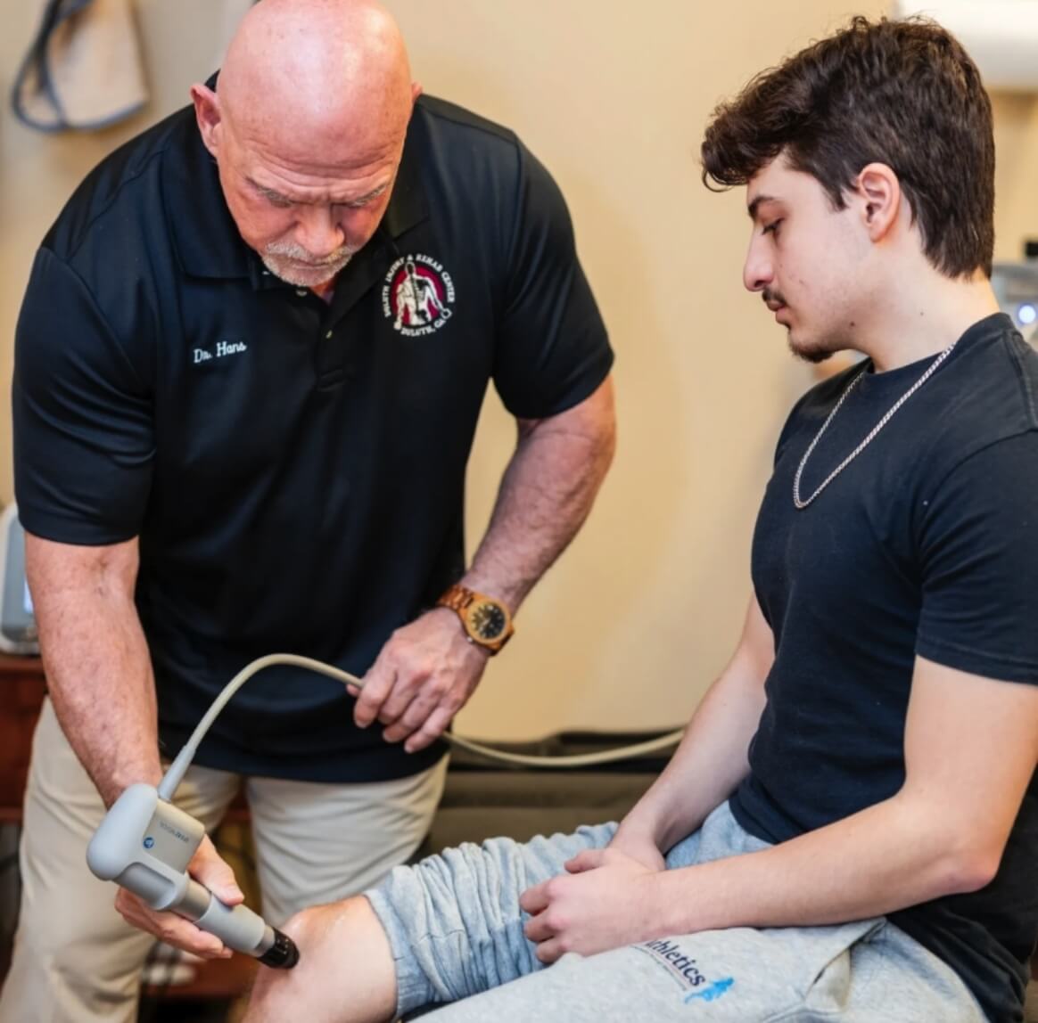 Duluth Chiropractor Dr. Joseph Hans working with patient