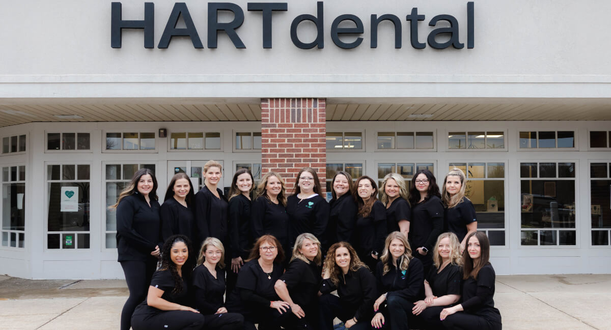 Hart Dental staff posing for photo outside the building