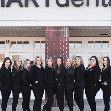 hart dental team standing front of office